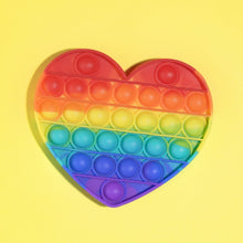 Heart-shaped pop it fidget toy with bubbles.